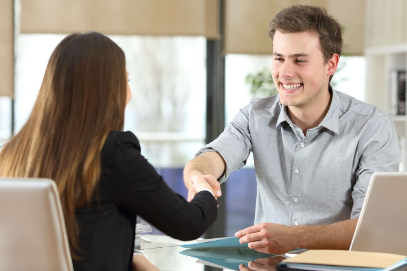 man-shaking-woman-hand