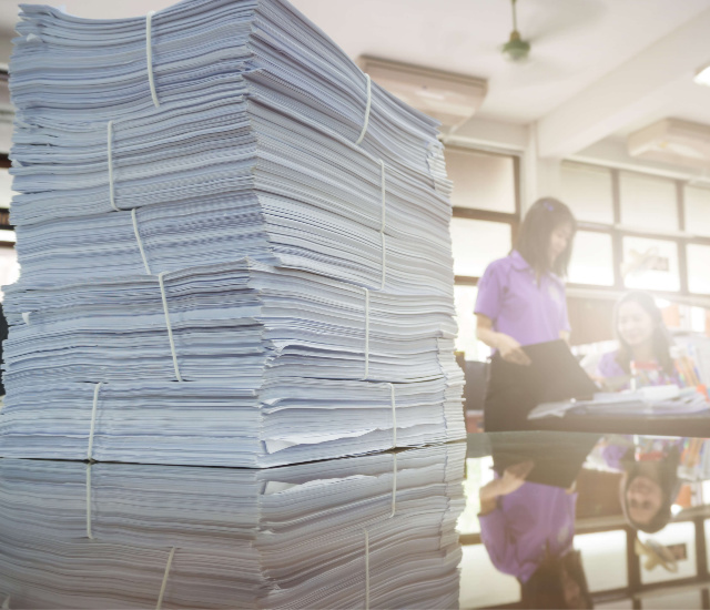 pile-papers-on-desk