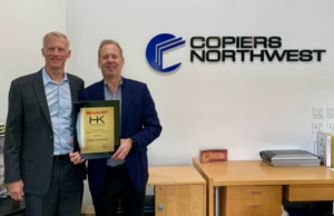 Photo of Ken Anderson from Sharp and Gregg Petrie President of Copiers Northwest with Award